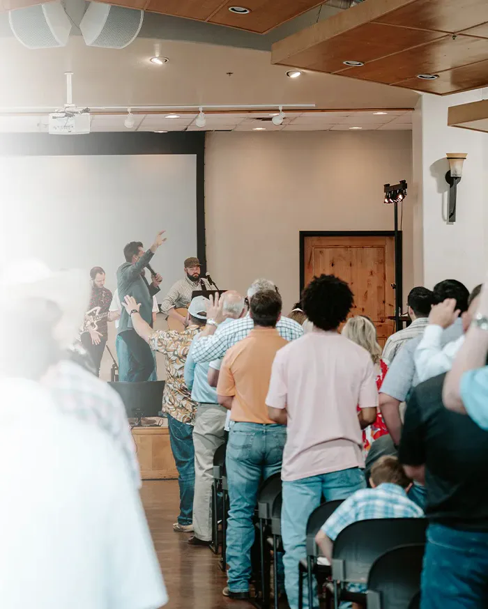 A congregation worshipping with raised hands