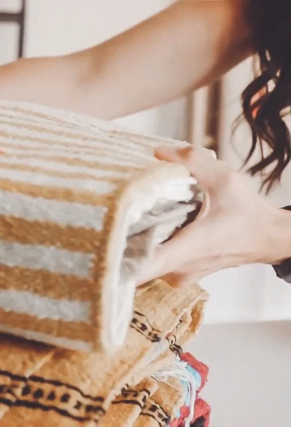 Hands holding a prayer blanket