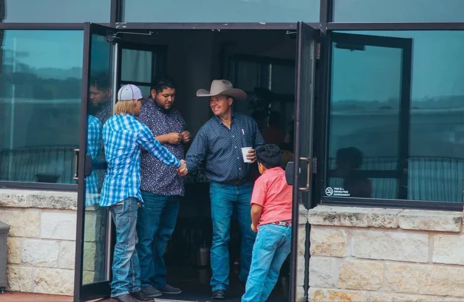 Volunteers greeting people at a gathering